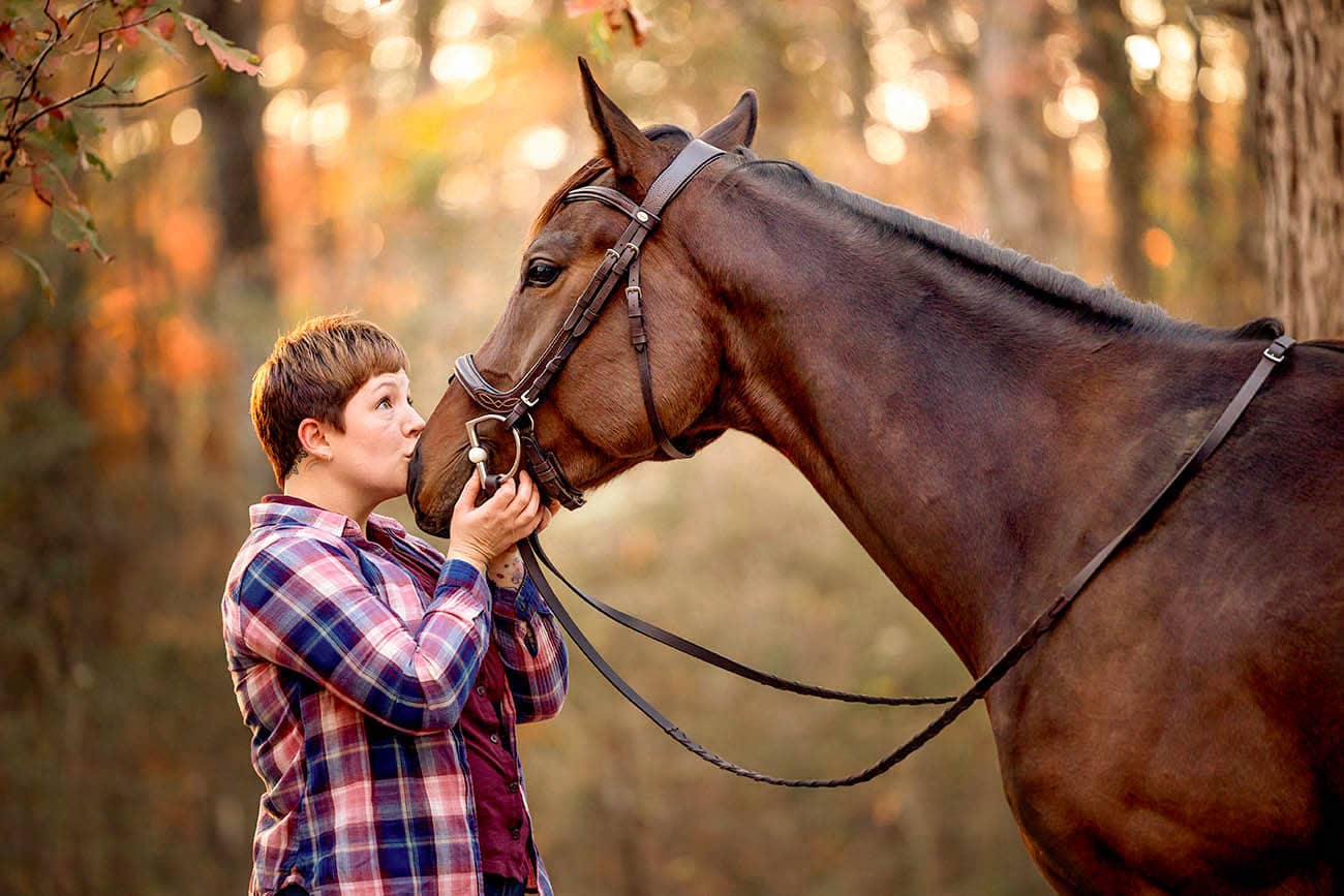 girl kissing horse