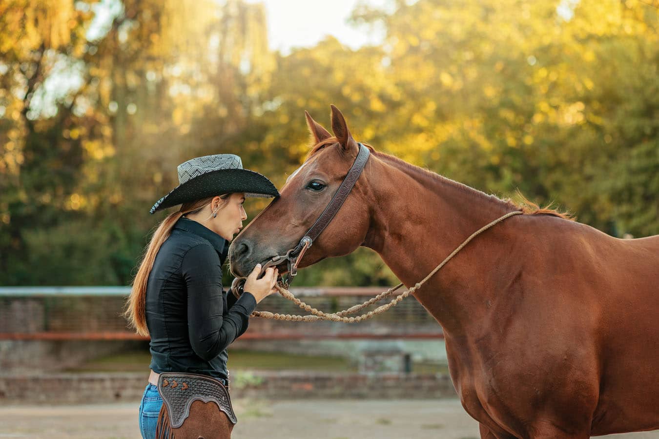 western cowgirl with her red mare at the mill Cleveland, tn